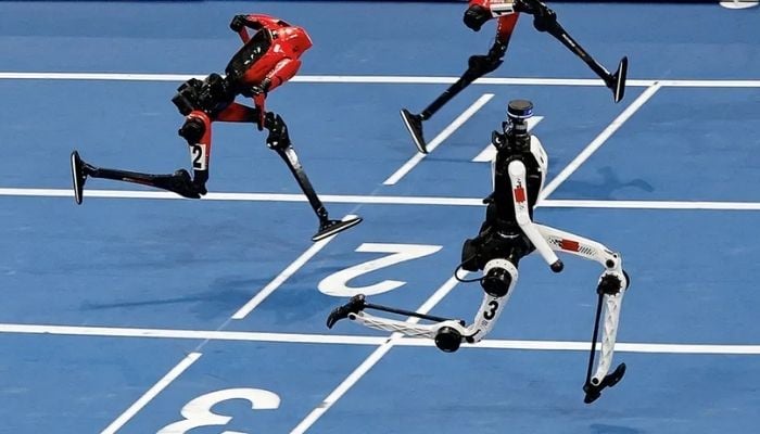 Humanoid robot nearly crashes into camera crew at Beijing World Robot Games
