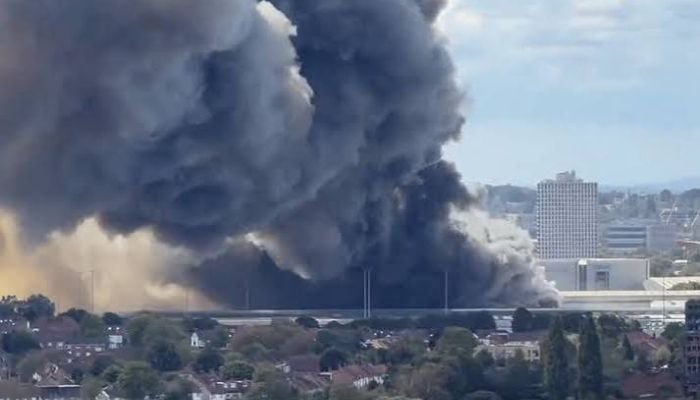 Huge fire breaks out near Wembley Stadium: 125 firefighters battle Neasden industrial estate blaze
