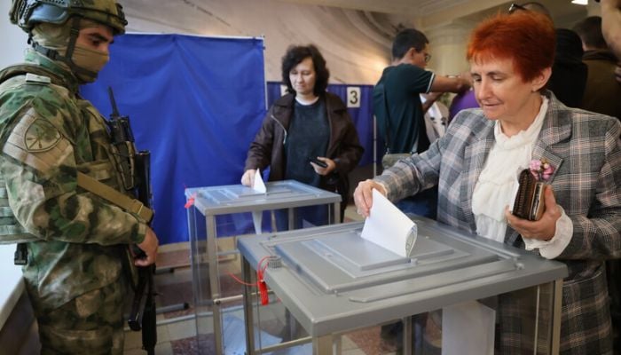 Kremlin tightens political grip as wartime Russia votes without opposition