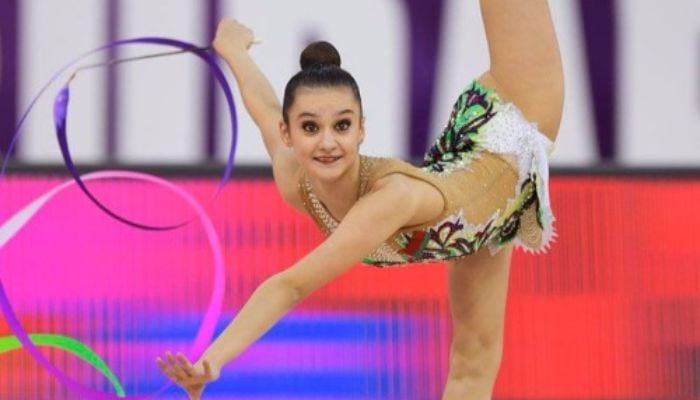 How Olympic gymnast Alina Harnasko pushes human flexibility to the limit