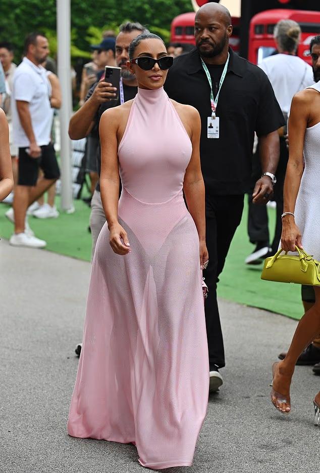 Kim Kardashian shows how to style a bold pink dress for high-profile sporting event
