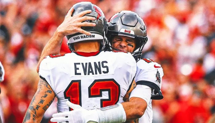 Brady jokes about throwing Evans’ historic TD ball into stands