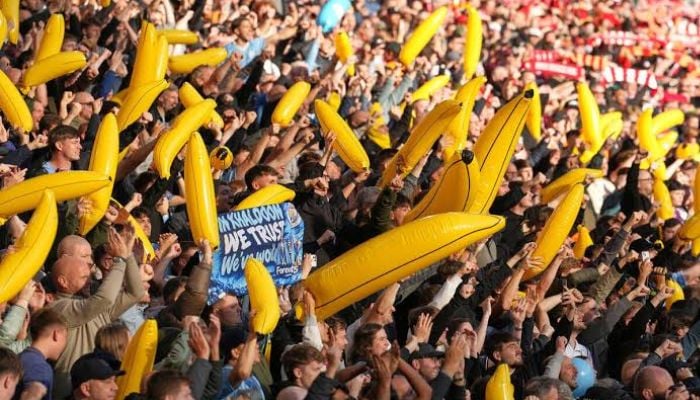 Man City fans wave inflatable bananas at Anfield in defiant display amid financial scandal