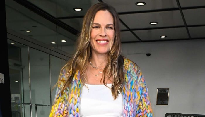 Hilary Swank flaunts her baby bump as she slams backlash over having child at 52