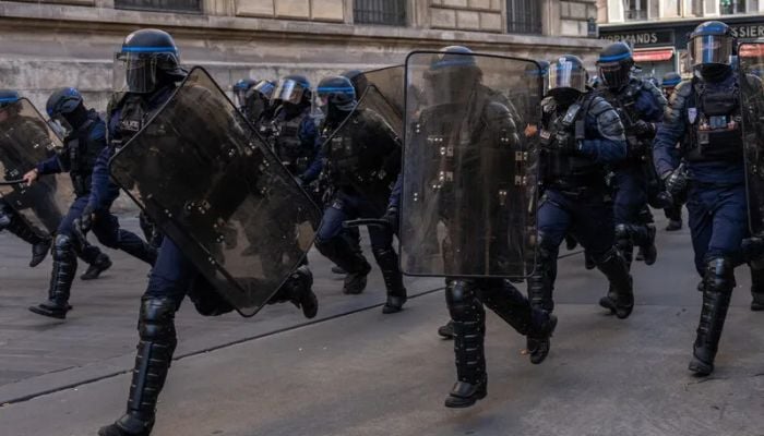 French authorities enact local curfews and thousands are arrested nationwide